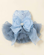 Back flat lay of a celestial blue sequin pet dress with an oversized layered blue bow, crystal centre brooch and voluminous tulle skirt.