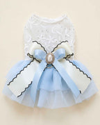 Flat lay of the Cinderella Blue Pearl Bow Pet Dress with its embroidered bodice, layered tulle skirt and decorative back bow