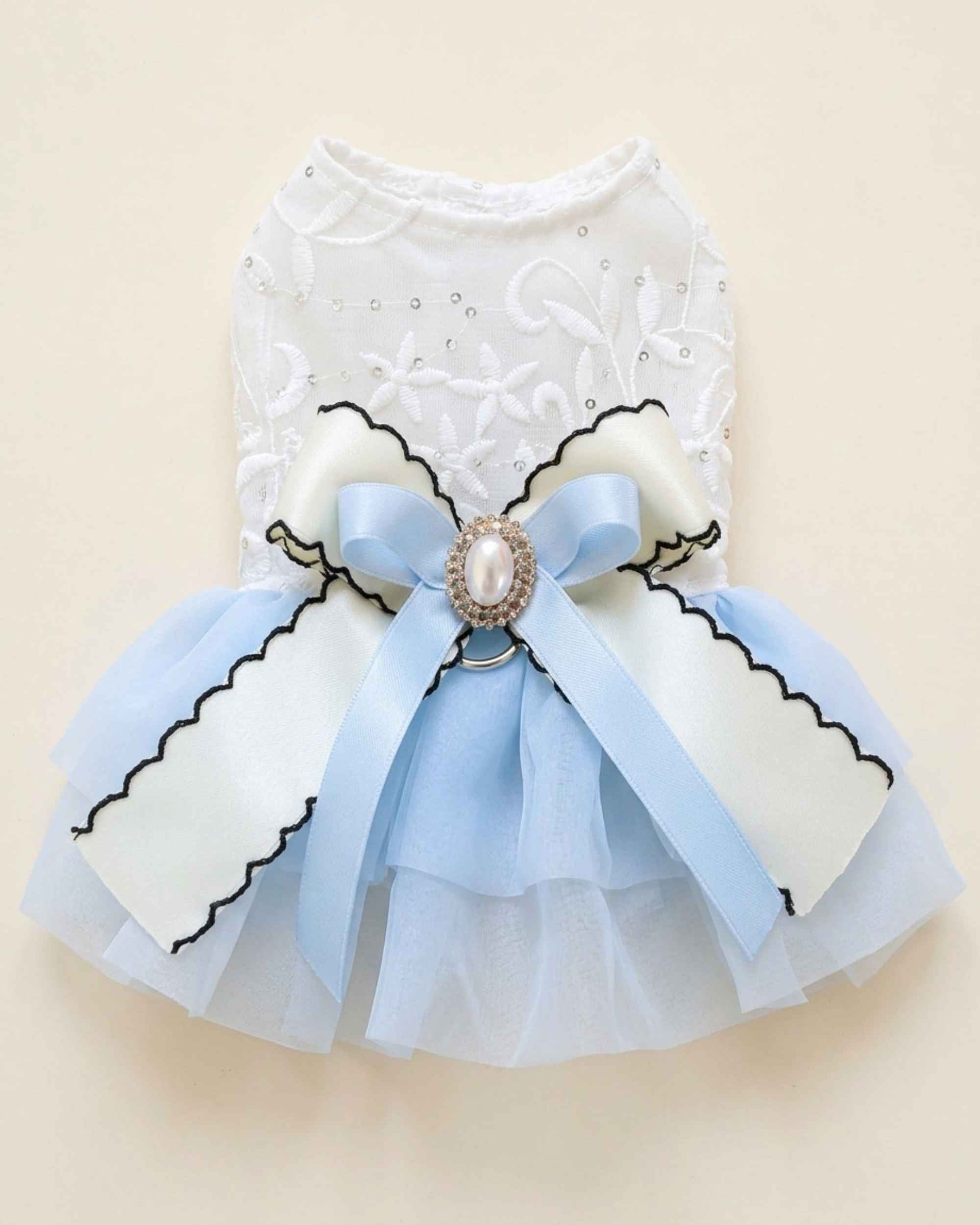 Flat lay of the Cinderella Blue Pearl Bow Pet Dress with its embroidered bodice, layered tulle skirt and decorative back bow