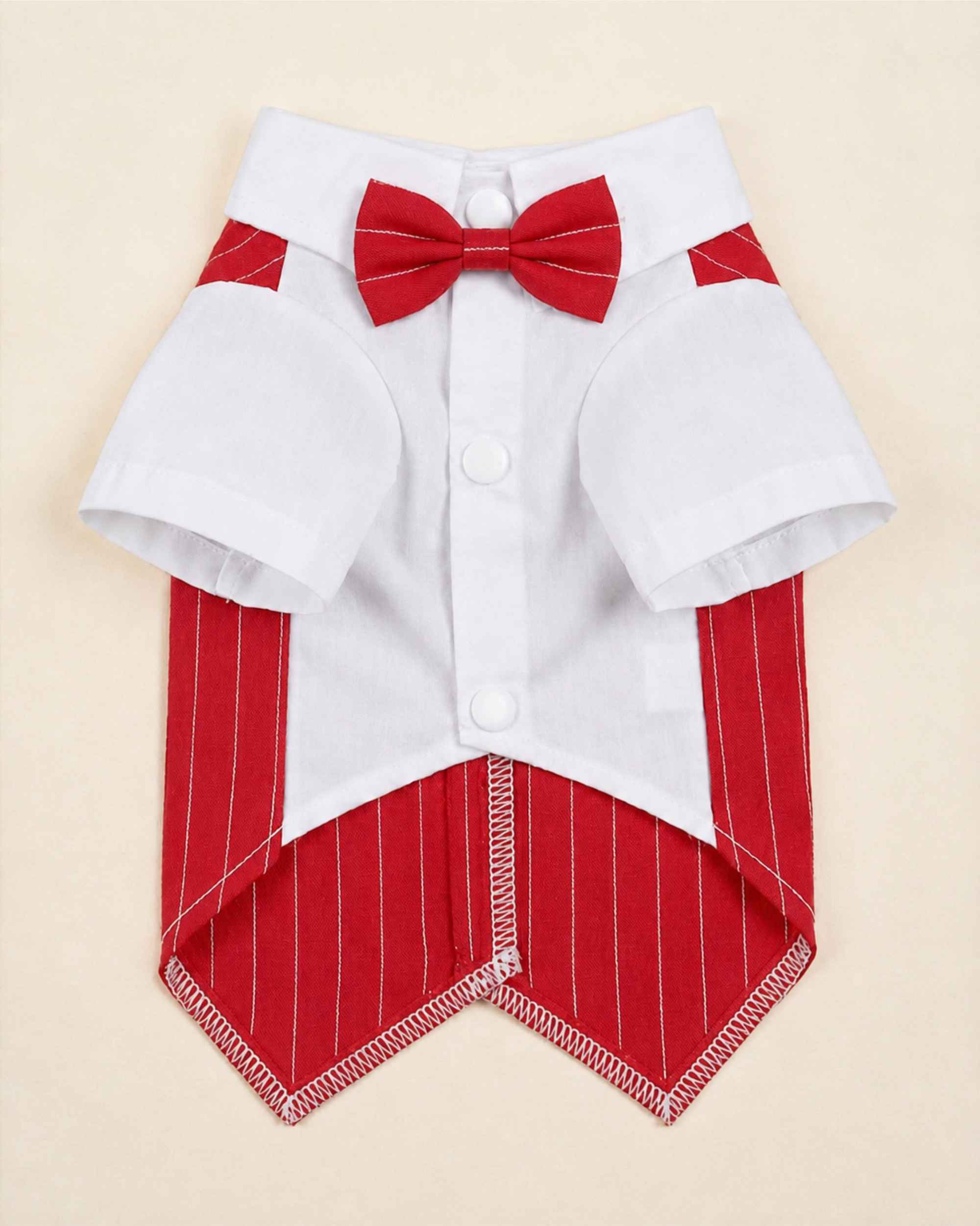 Closure-side flat lay of the crimson red pinstripe pet waistcoat with white shirt, matching bow tie, snaps and pointed hem