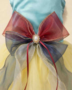 Close-up of the burgundy navy and silver layered organza bow with pearl-style crystal centre on an aqua satin pet dress