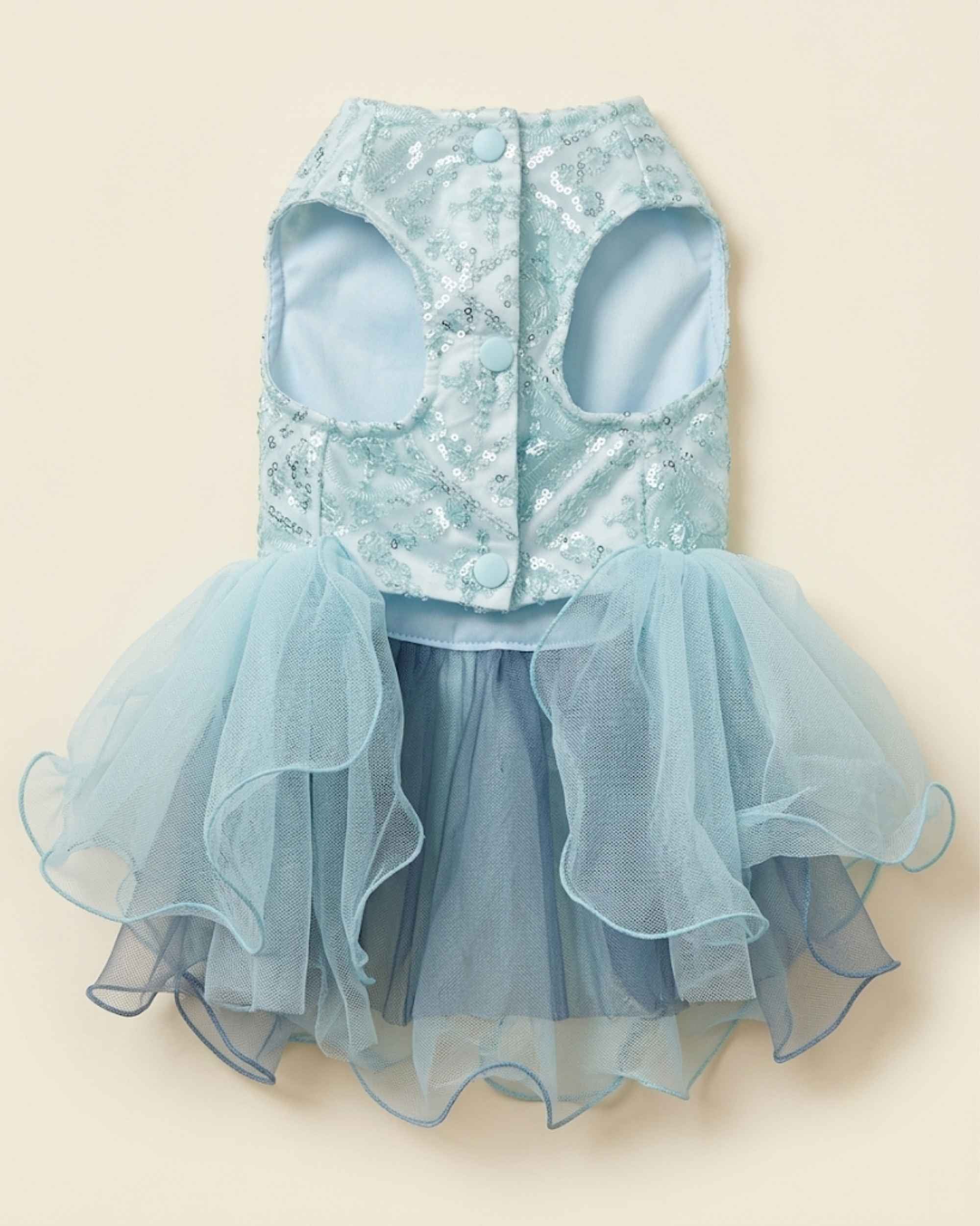 Front closure flat lay of the seafoam mint pet dress showing three snap buttons, leg openings and layered tulle skirt.