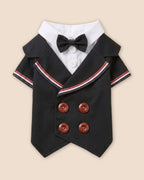 Decorative-side flat lay of the Midnight Black pet tuxedo featuring a black bow tie, white shirt insert, striped lapels and four brown buttons.