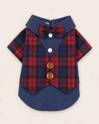 Display-side flat lay of the navy and red plaid pet waistcoat shirt featuring a matching bow tie, navy collar, white snaps and two brown buttons.