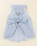 Back flat lay of the sky blue pet harness dress with a silver D-ring, oversized bow, long ribbon tails and scalloped hem