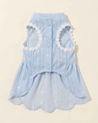 Front flat lay of the sky blue pet dress showing three snap closures, two lace-trimmed leg openings and scalloped skirt
