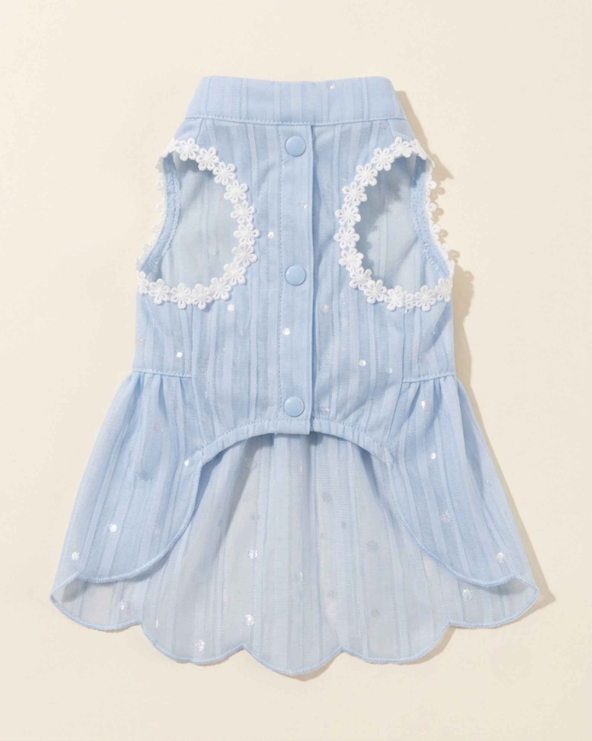 Front flat lay of the sky blue pet dress showing three snap closures, two lace-trimmed leg openings and scalloped skirt